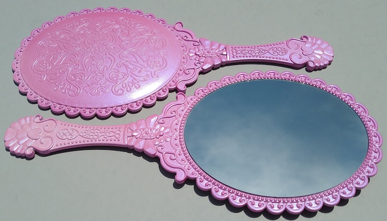 pink hand mirror