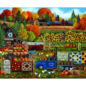 May include: A colorful autumn farm scene featuring a blue truck labeled Buttermilk Farm, a red tractor, and a rustic barn. The landscape includes fields of sunflowers, pumpkins, and hanging quilts with geometric patterns, all set against a vibrant fall forest.