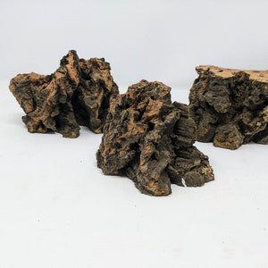 May include: Three pieces of brown and orange cork bark, ideal for use in terrariums or aquariums.