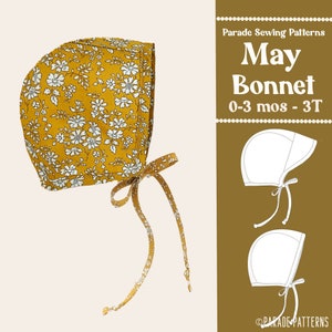Op de afbeelding: Een gele muts met een witte bloemenprint en een bijpassende strik. De muts heet "May Bonnet" en is geschikt voor baby's en peuters van 0-3 maanden tot 3 jaar oud. Het patroon is van Parade Sewing Patterns.