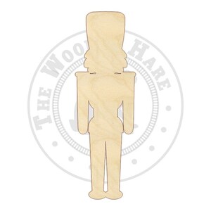 May include: Unfinished wooden nutcracker cutout. The cutout is shaped like a traditional nutcracker with a tall hat, a long coat, and a mustache.