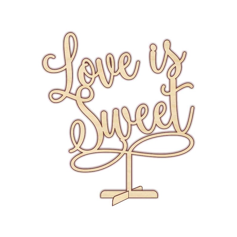 May include: Wooden cutout of the phrase "Love is Sweet" with a decorative swirl design. The cutout is mounted on a wooden stand.