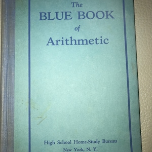 May include: The cover of a blue book titled "The Blue Book of Arithmetic" by the High School Home-Study Bureau, New York, N.Y.