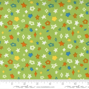 Może przedstawiać: Zielony materiał z powtarzającym się wzorem białych, pomarańczowych, żółtych, niebieskich i zielonych gwiazd i kół. Materiał jest oznaczony linijką w calach.