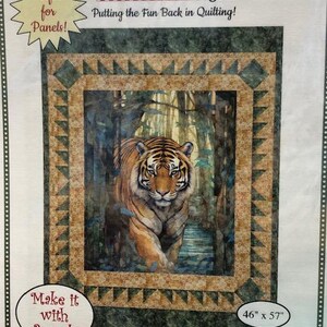 May include: Quilting pattern featuring a tiger in a jungle setting. The pattern is titled "Majestic" and is 46 inches by 57 inches. The pattern is perfect for panels and requires 3 yards of fabric.