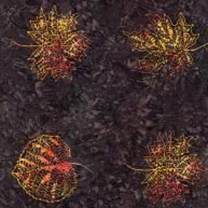 May include: A dark brown fabric background with multiple embroidered leaves in shades of orange, yellow, and red. The leaves are arranged in a random pattern and are all different sizes and shapes.