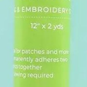 May include: A green and white label on a white tube of double-sided bonding fabric. The label reads "Double-Sided Bond Pro for Embroidery & Crafts 12" x 2 yds". The label also says "For patches and more, permanently adheres two fabrics together, no sewing required."