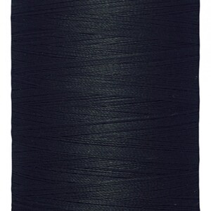 May include: A spool of black Gutermann thread with 1000 meters or 1094 yards of thread.