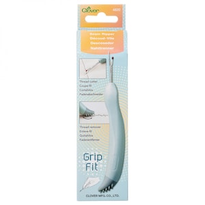 May include: A blue seam ripper with a white handle and a metal blade. The packaging says "Seam Ripper" and "Grip Fit".