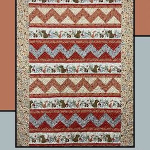May include: A quilt pattern featuring a red, white, and gray chevron design with a repeating border of woodland animals. The title "Zip-a-Dee-Doo-Dah" is at the top of the pattern. The text "Molly Cook for Villa Rosa Designs" is at the bottom of the pattern.