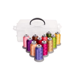 May include: A clear plastic storage box with a black handle, holding spools of colorful thread. The thread colors include pink, purple, orange, blue, yellow, green, and brown. The spools are arranged in a triangular pattern.