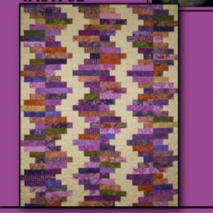 May include: A quilt pattern called "Wistful" by Villa Rosa Designs. The quilt is made of purple, green, and orange fabric in a geometric pattern.