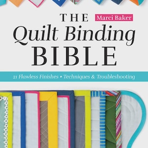 May include: The Quilt Binding Bible by Marci Baker. The book cover features a variety of colorful quilt binding samples, including blue, pink, yellow, and green. The title is in large, bold letters, with the author's name in a pink box.