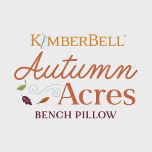 Pode incluir: O logotipo da Kimberbell é exibido acima das palavras "Autumn Acres Bench Pillow" em uma paleta de cores quentes. O design inclui folhas e redemoinhos, sugerindo um tema de outono. O texto está em uma fonte decorativa.