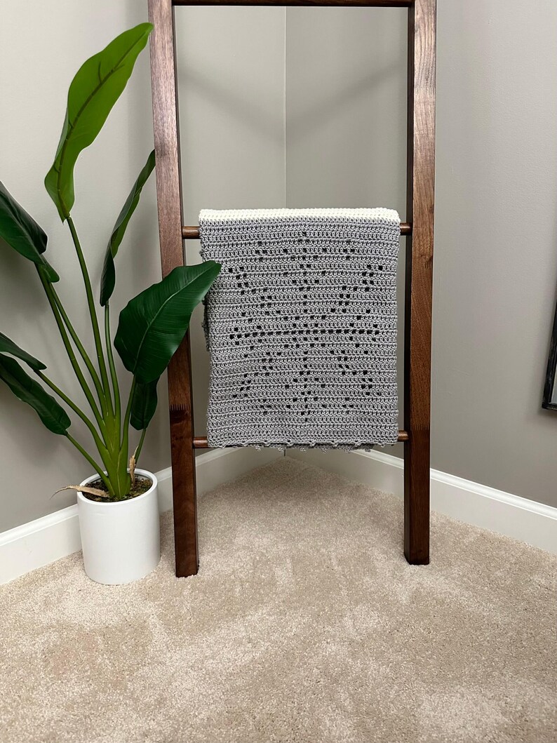 a potted plant sitting next to a wooden chair