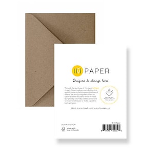 May include: A brown envelope with a white card inside. The card has a yellow logo with the text "IM PAPER" and the text "Designed to change lives." The card also has a small illustration of a bowl of soup.