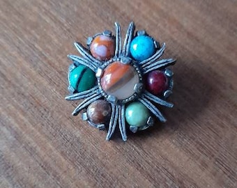 Miracle brooch in silver tone clasp with multicoloured stones in reds, blues, greens and orange tones, beautiful retro vintage piece