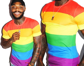 May include: A rainbow striped t-shirt with short sleeves. The shirt has six horizontal stripes in the colors of the rainbow: red, orange, yellow, green, blue, and purple.