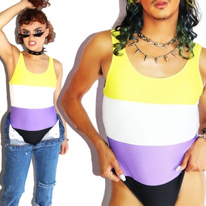 May include: A yellow, white, and purple striped swimsuit with a black bottom.