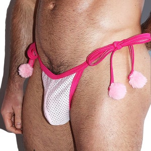 May include: White mesh underwear with pink trim and pink pom-poms on the ties.