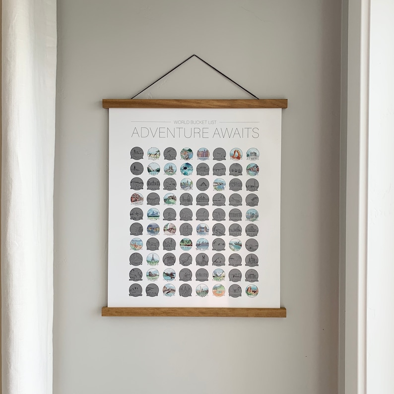 May include: A framed world bucket list poster with the text "WORLD BUCKET LIST ADVENTURE AWAITS" and a grid of 100 illustrated travel destinations.