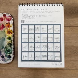 May include: A spiral-bound art pad with the text "ART FOR ANY LEVEL" and illustrations of various locations. The pad includes 24 ink sketches on 9x12 inch watercolor paper, a practice page, and a color mixing chart. A watercolor palette is visible.