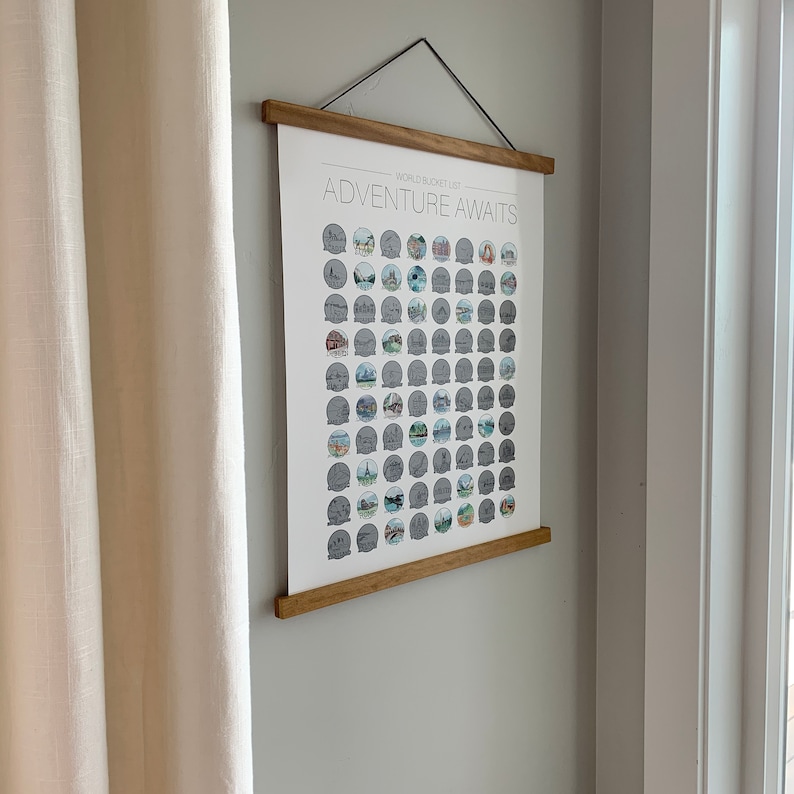 May include: A framed world bucket list poster with the text "WORLD BUCKET LIST ADVENTURE AWAITS" and a grid of illustrated travel destinations.
