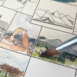 Op de afbeelding: Een close-up van een aquarel schilderij van verschillende landschappen. Een penseel wordt gebruikt om groene verf toe te voegen aan een deel van het schilderij dat een bos voorstelt.