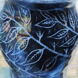 wheel-thrown black ceramic vase with graffito leaf design