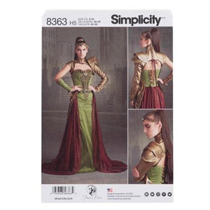May include: Simplicity sewing pattern number 8363 H5 for a fantasy-inspired costume. The pattern includes a corset, skirt, and cape with gold and green accents. The pattern is designed for sizes US 6-14, Talla Euro 32-40, and Taille Fr 34-42.