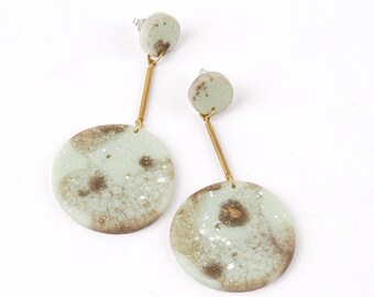 Earrings "cosmic planet", marbled pastelgreen and gold, made of resin, with silver studs and brass tubes