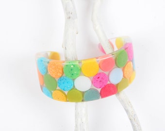 Cuff bangle, translucent resin, opaque multicolred dots, fits S
