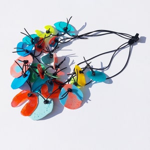 PUZZLE necklace No. 6, short length, three strands, multicolor, resin elements on rubber cord image 2