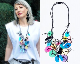 PUZZLE necklace, three strands, multicolor, resin elements on rubber cord