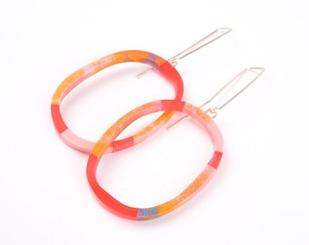 Slim loop earrings, orange marbled, with silver hook