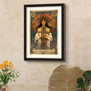 May include: A framed vintage poster with a woman in a white dress and a headdress. The poster has a gold background with a circular design and the text "Fin de Si&egrave;cle" at the bottom.