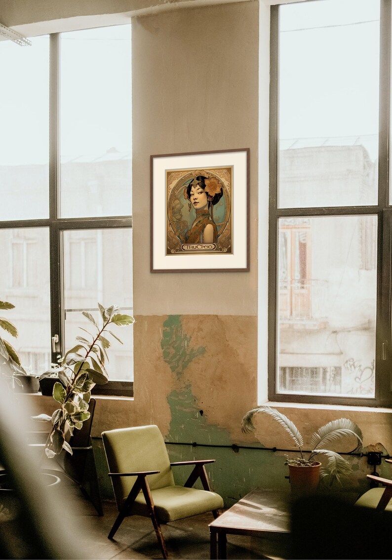 May include: A framed art print featuring a woman in a vintage style illustration. The woman is wearing a blue and gold dress with a flower in her hair. The print has a gold background with ornate details and the word "TRUCHTER" at the bottom.