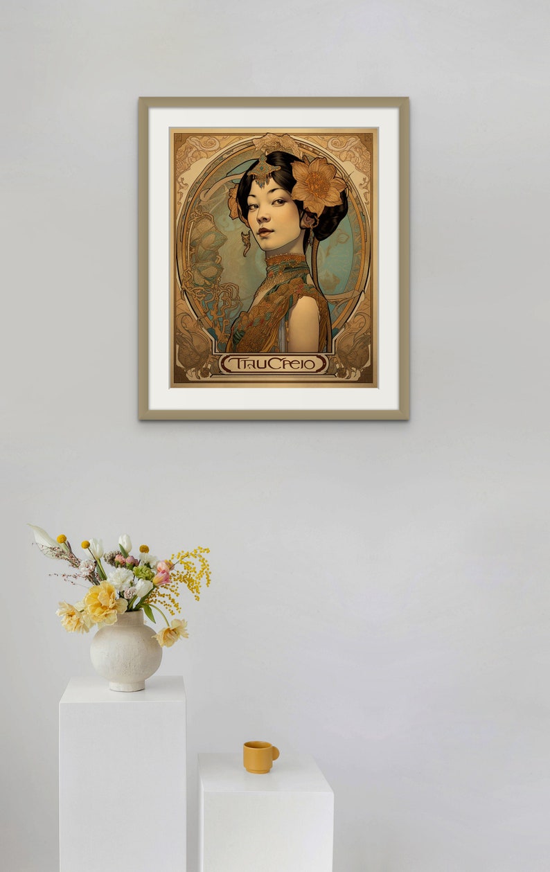 May include: A framed art print featuring a woman with a flower in her hair. The print is in an Art Nouveau style and has a gold frame. The text "Tracfeio" is at the bottom of the print.