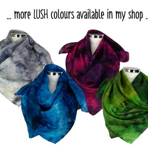 May include: Four silk scarves in different colours: grey, blue, purple, and green. Each scarf has a tie-dye pattern with shades of the main colour.