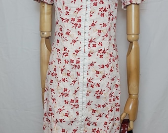 Vestido mini rosa con ganchos Britney de Urban Outfitters, talla pequeña