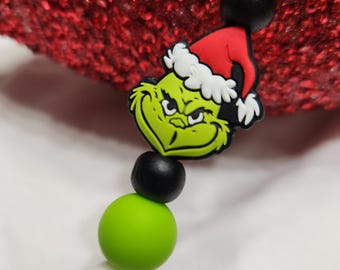 Attache-suce en silicone Grinch : cadeau de fête prénatale