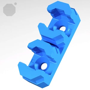 May include: A vibrant blue plastic component with a geometric design. It features curved, open sections and circular holes. The object has a rectangular shape with angled protrusions. The design is modern and industrial.