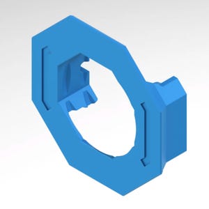 May include: A light blue, geometric object with a central aperture. The object has a hexagonal outer form with a rounded inner shape. It features rectangular cutouts and a small, rectangular projection.