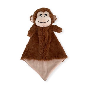 May include: A brown plush monkey security blanket with a soft, tan fabric on the back. The monkey has a smiling face with black eyes and a black nose.