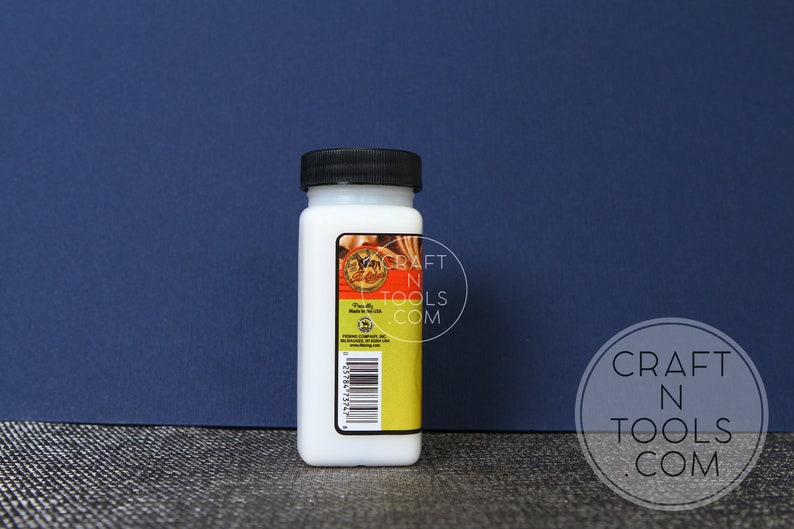 May include: A white plastic bottle with a black lid. The bottle is labelled with the text "Craft N Tools.com".
