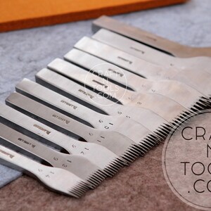 May include: A set of 10 silver leather stitching tools with a serrated edge. The tools are arranged in a row, with the smallest tool on the left and the largest tool on the right. The tools are labeled with numbers from 1 to 10. The tools are on a gray surface. The text "CRAFT N TOOLS .COM" is visible in the lower right corner of the image.