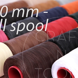 May include: A close-up of spools of waxed thread, each a different color. The spools are arranged in a row, with the text "1.0 mm - full spool" visible at the top of the image.