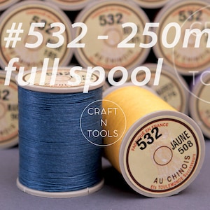 May include: Two spools of thread, one blue and one yellow, labeled with the number 532 and the text "Craft N Tools". The spools are 250 meters long.