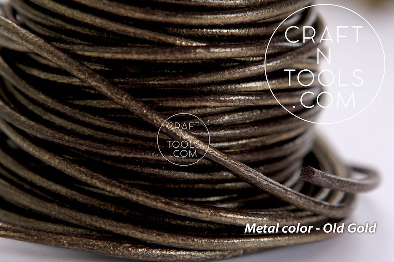 May include: Close-up of a spool of brown leather cord with a metallic gold finish. The cord is wound tightly and has a smooth, textured surface. The text "CRAFT N TOOLS .COM" is visible on the spool.