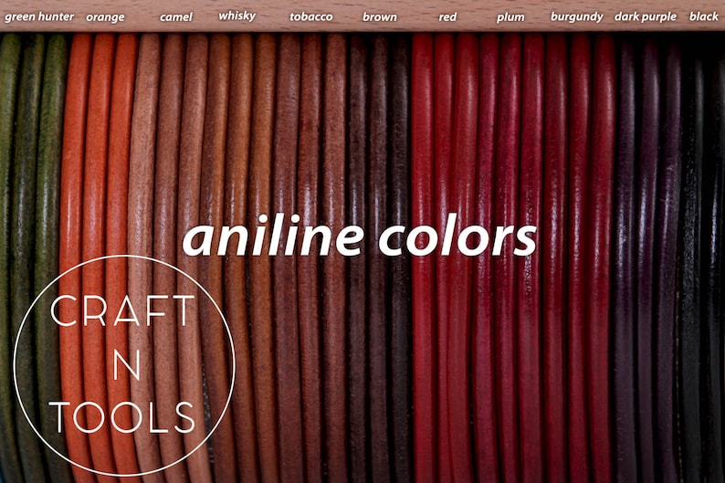 May include: A close-up of a variety of leather cords in different colors, including green hunter, orange, camel, whisky, tobacco, brown, red, plum, burgundy, dark purple, and black. The cords are arranged in a row and labeled with their corresponding colors. The text "aniline colors" is written in white letters on a black background. The text "CRAFT N TOOLS" is written in white letters on a circle with a black outline.